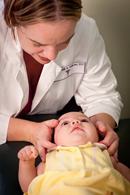 Chiropractic Goleta CA Infant Neck Adjustment Dr. Crystal Galvan adjusting an infant's neck