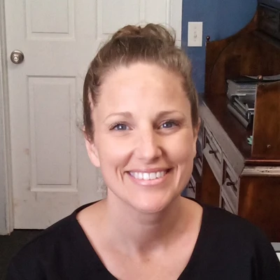 A headshot photo of Katrina, the chiropractic front desk receptionist at Crystal Chiropractic