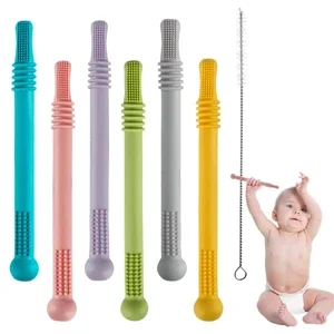 Chiropractic Goleta CA Bebecan A baby holding Bebecan teething tool